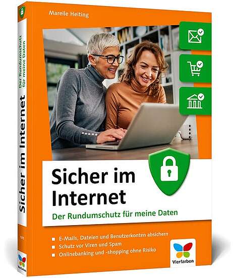Zwei Frauen vor einem Notebook sitzend.