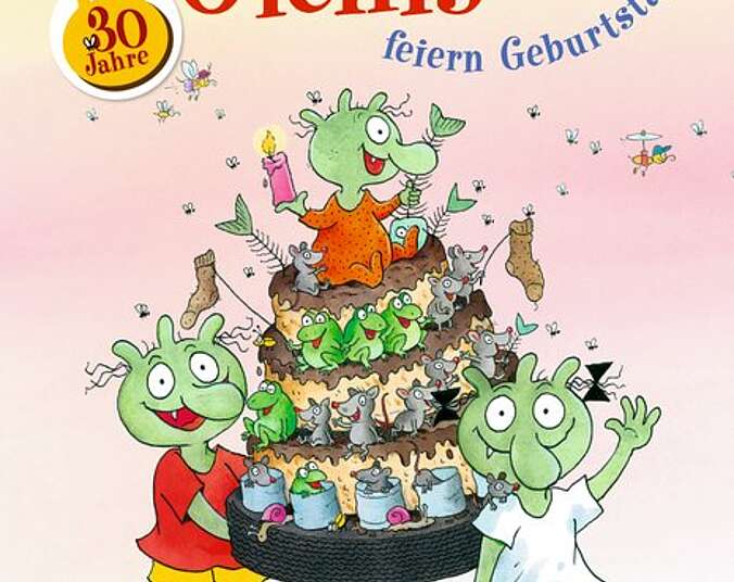 Die Olchis mit einer riesigen olchigen Geburtstagstorte.